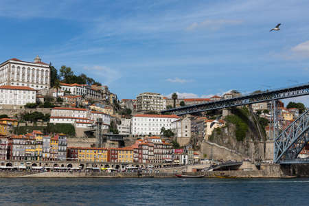 View of Porto city at the riverbank (Ribeira quarter) and wine boats(Rabelo) on River Douro(Portugal), a UNESCO World Heritage City.の写真素材