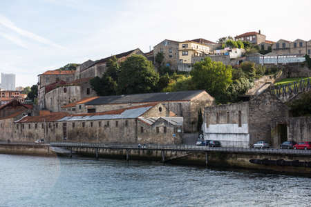 View of Porto city at the riverbank (Ribeira quarter) and wine boats(Rabelo) on River Douro(Portugal), a UNESCO World Heritage City.の写真素材