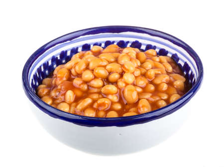 Marinated haricot beans in tomato sauce with shallots on a plateの写真素材