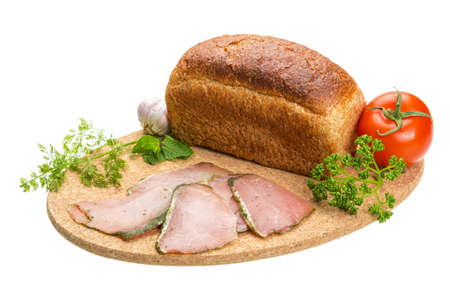 Ripe fresh ham with vegetables and breadの写真素材