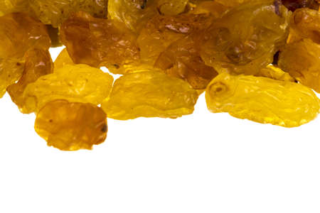 Golden raisins over whiteの写真素材