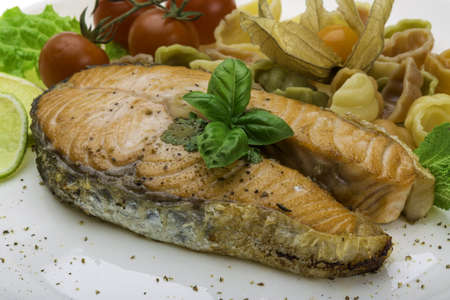 Grilled salmon with pastaの写真素材