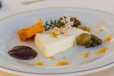 Sheep cheese with herbs, fruits and nutの写真素材