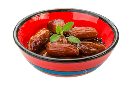 Dates with leaf on the plate