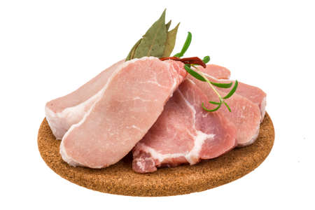 Raw pork steak with spicesの写真素材