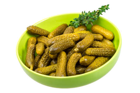 Small Marinated cucumbers in the bowl isolatedの写真素材