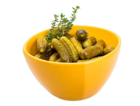Small Marinated cucumbers in the bowl isolatedの写真素材