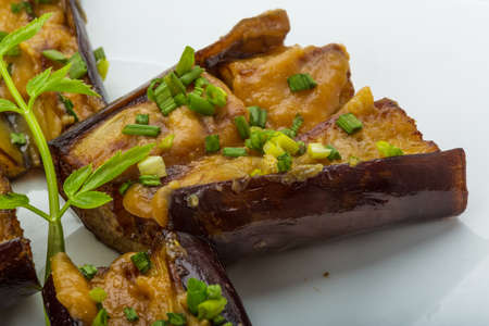 Grilled eggplant with onion and souceの写真素材