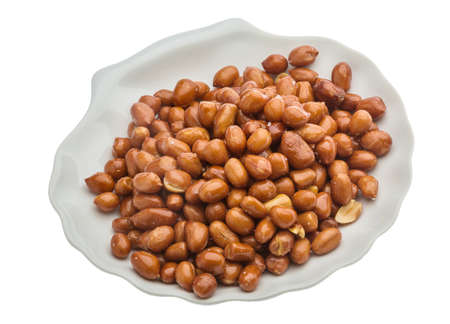 Fried peanuts heap isolated on white