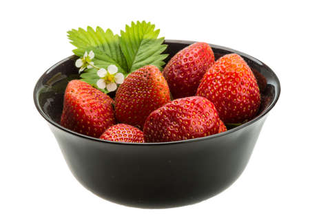 Ripe strawberry with leaves and flowerの写真素材