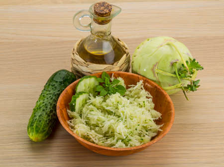 Kohlrabi and cucumber salad with basilの写真素材