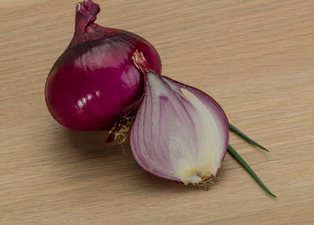 Red bright juicy onion on the deskの写真素材