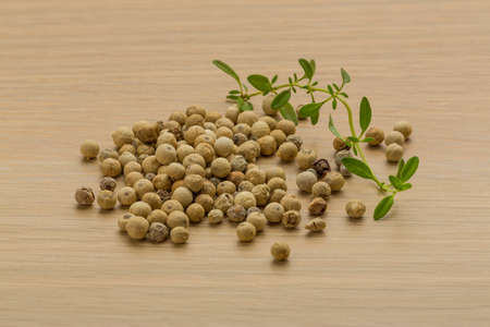 White pepper corn heap on the deskの写真素材