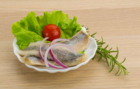 Herring fillet with onion and herbsの写真素材