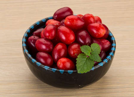Cornus berries in the bowl on board
