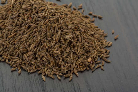 Caraway seeds on the deskの写真素材