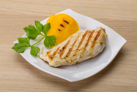 Grilled chicken breast with pepper and herbsの写真素材