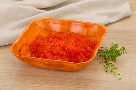 Red caviar in the bowl on deskの写真素材