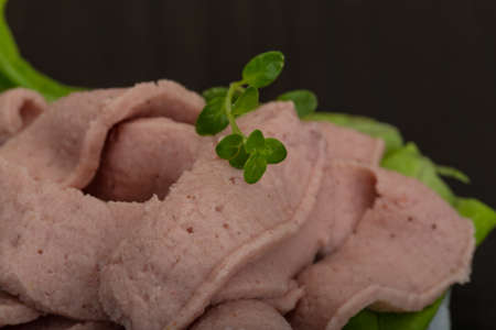 Liver canape with salad leaves and herbsの写真素材