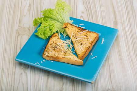 French toast with cheese and salad leavesの写真素材