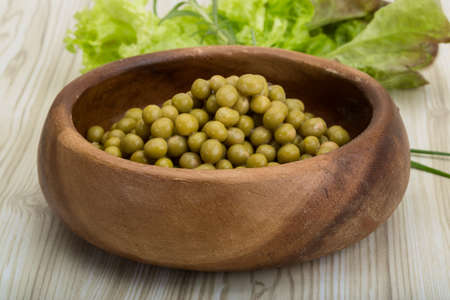 Marinated peas - in the bowl with salad leavesの写真素材