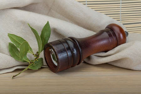 Pepper mill with laurel and garlicの写真素材