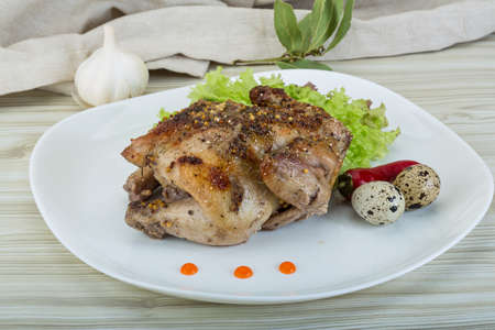 Grilled quail with eggs and spices on wooden の写真素材