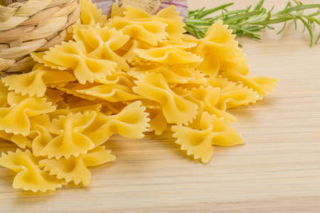 Raw Farfalle with oil and herbs