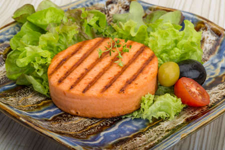 Grilled Fish cakes in the bowl with salad leavesの写真素材
