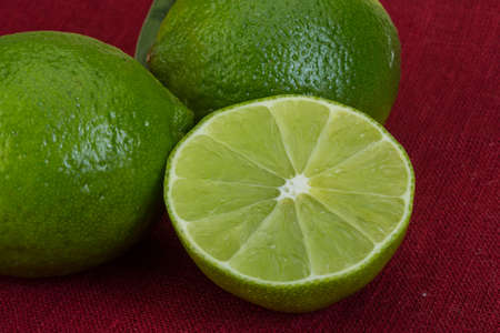 Fresh green lime on the wooden 