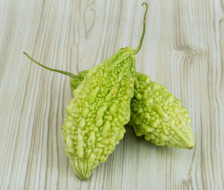 Asian vegetable - momordica on the wood background