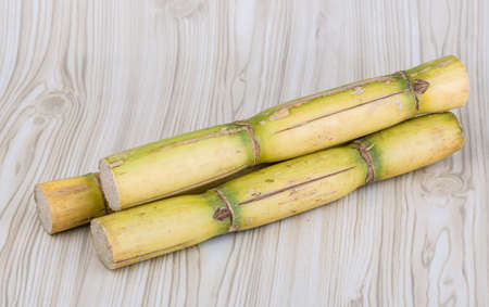 Sugar reed sticks on the wooden backgroundの写真素材