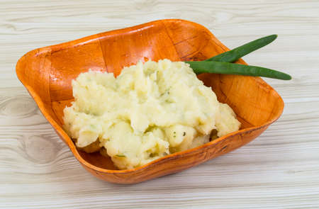 Mash potato in the bowl with green onionの写真素材