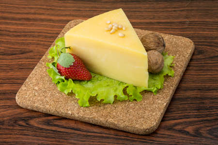 Parmesan cheese triangle with strawberry and wallnutsの写真素材