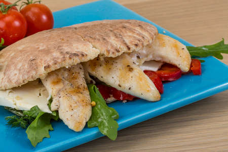 Pita with ruccola and grilled chicken breastの写真素材