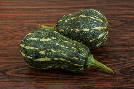 Two Green pumpkins on the wooden backgroundの写真素材