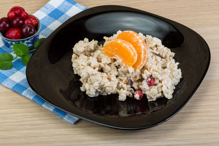 Oatmeal with fresh berries in the bowlの写真素材