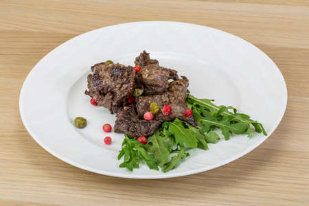 Roasted venison meat with ruccola and cranberriesの写真素材