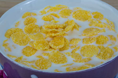 Breakfast with cornflakes on the white background