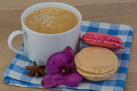 Capuccino with macaroons served orchid flowerの写真素材