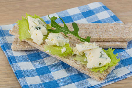 Crispbread with soft blue cheese and saladの写真素材