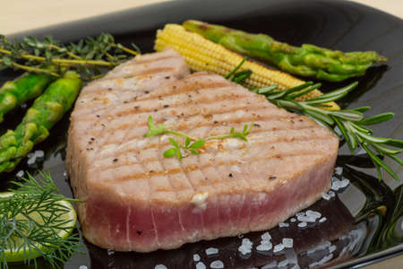 Grilled Tuna steak with asparagus and rosearyの写真素材