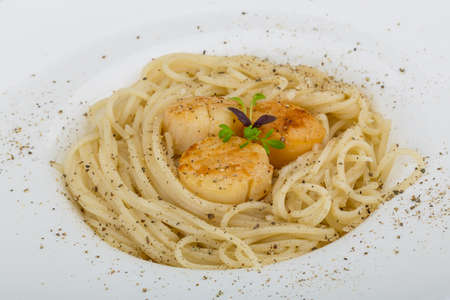 Pasta with scallops and fresh green herbsの写真素材