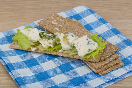 Crispbread with soft blue cheese and saladの写真素材