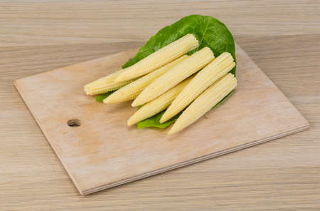 Fresh ripe Baby corn on the wood backgroundの写真素材