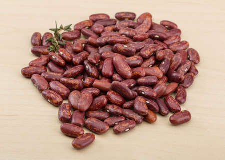 Dry beans kidney heap on the wood background