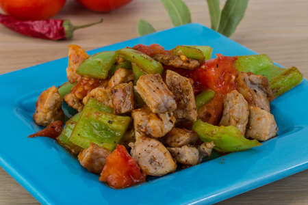 Stir fried pork with pepper and tomatoの写真素材