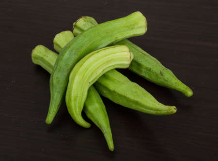Asian vegetable - okra on the wood backgroundの写真素材