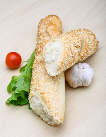 Fresh crust Baguette with sesame seeds and saladの写真素材