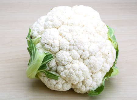 Raw Cauliflower on the wood backgroundの写真素材
